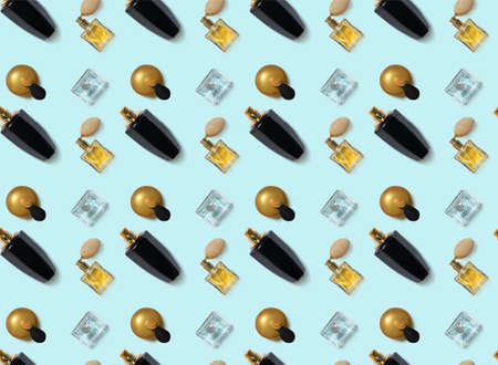Bottles of perfumes on color background