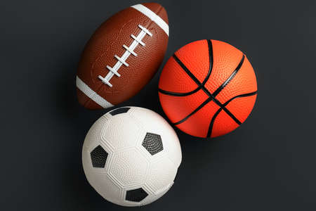 Sports balls on dark background