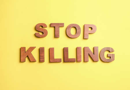 Text STOP KILLING on color background. Stop racismの写真素材