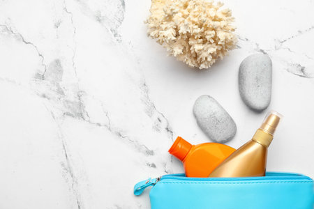 Bag with sunscreen cream on white backgroundの写真素材