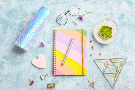 Composition with notebook on color background