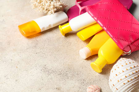 Bag with sunscreen cream on gray backgroundの写真素材