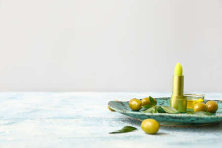 Natural lip balm with olive oil on tableの写真素材