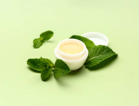 Natural lip balm with mint on color backgroundの写真素材