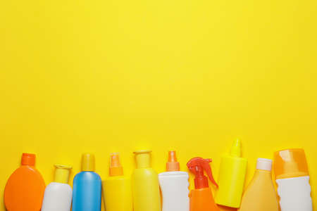 Bottles of sunscreen on color backgroundの写真素材
