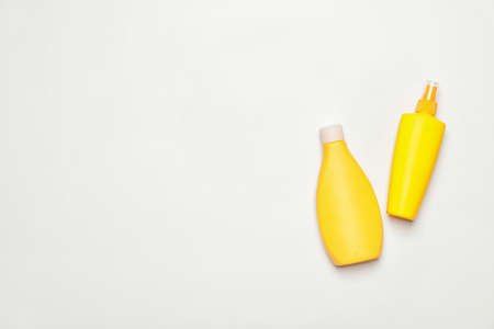 Bottles of sunscreen on white backgroundの写真素材