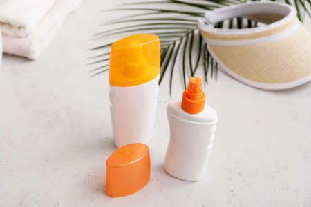 Bottles of sunscreen on light backgroundの写真素材