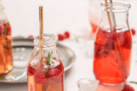 Bottles of fresh ice tea on tableの写真素材