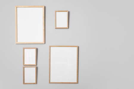 Blank photo frames hanging on wall