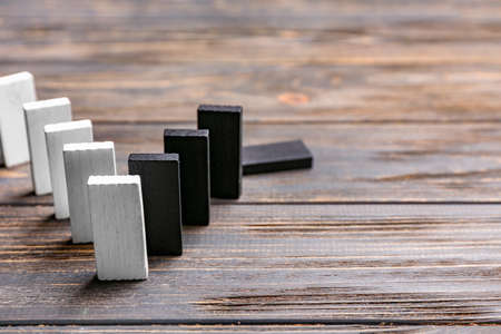 Different blocks on wooden background. Racism conceptの写真素材