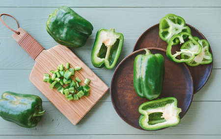 Composition with green bell pepper on tableの写真素材