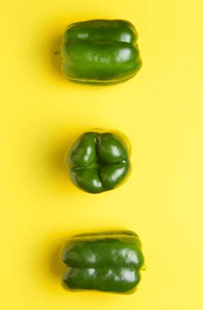 Green bell pepper on color backgroundの写真素材