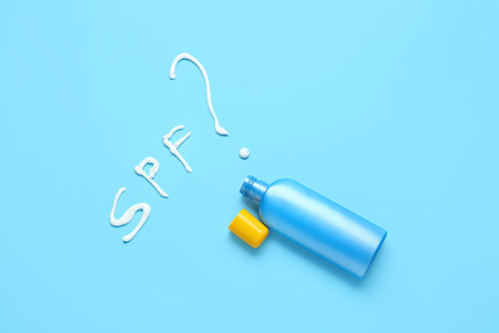 Bottle of sunscreen on color backgroundの写真素材
