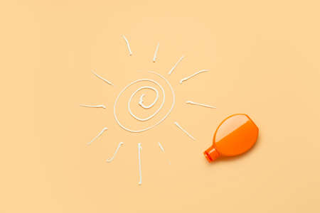 Bottle of sunscreen on color backgroundの写真素材