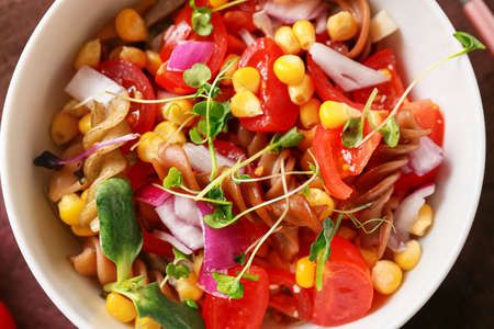 Bowl with tasty pasta salad, closeupの写真素材