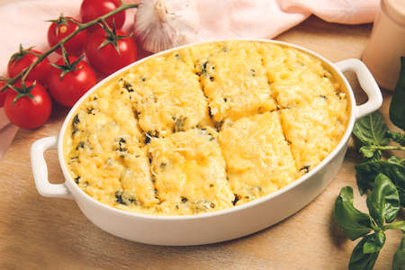 Baking dish with tasty rice casserole on tableの写真素材