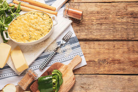 Baking dish with tasty rice casserole on tableの写真素材