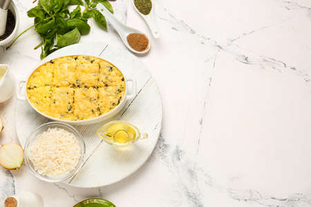 Baking dish with tasty rice casserole on tableの写真素材