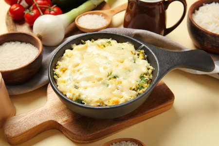 Baking dish with tasty rice casserole on tableの写真素材