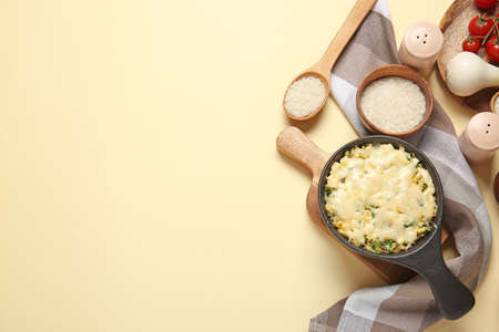 Baking dish with tasty rice casserole on color backgroundの写真素材