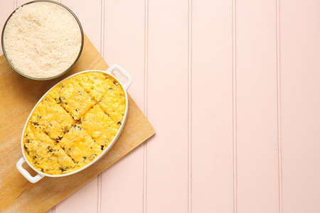 Baking dish with tasty rice casserole on tableの写真素材