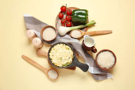 Baking dish with tasty rice casserole on color backgroundの写真素材