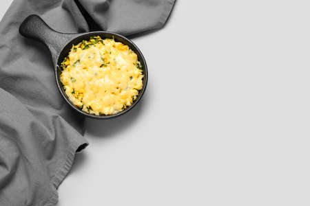 Baking dish with tasty rice casserole on light backgroundの写真素材