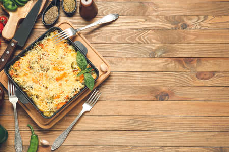 Baking dish with tasty rice casserole on tableの写真素材