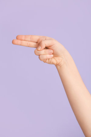 Hand showing letter H on color background. Sign language alphabetの写真素材
