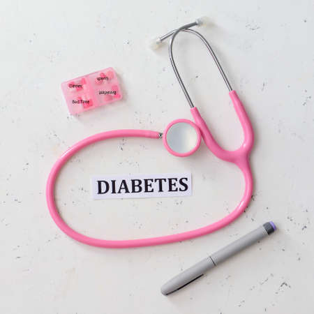 Word DIABETES, stethoscope, lancet pen and pills on white backgroundの写真素材