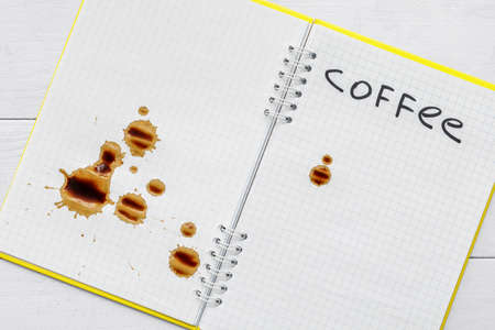 Coffee stain on notebook, closeupの写真素材