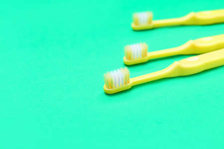 Tooth brushes on color backgroundの写真素材