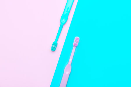 Tooth brushes on color backgroundの写真素材