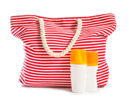 Beach bag with sunscreen cream on white backgroundの写真素材