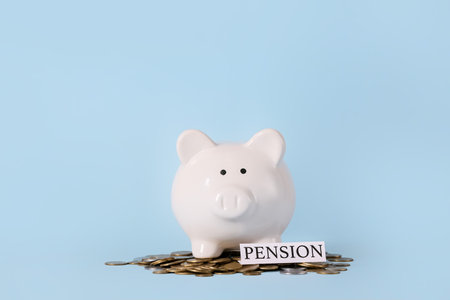 Piggy bank with savings on color background. Concept of pensionの写真素材