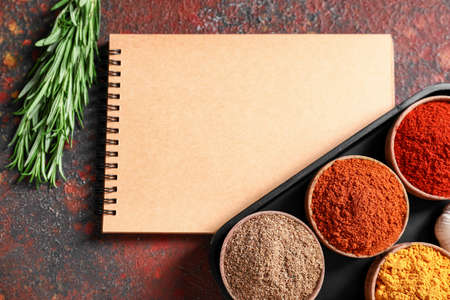 Empty notebook with spices on grunge backgroundの写真素材
