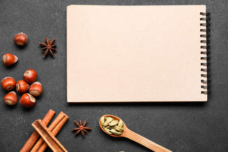 Cook book with spices on dark backgroundの写真素材