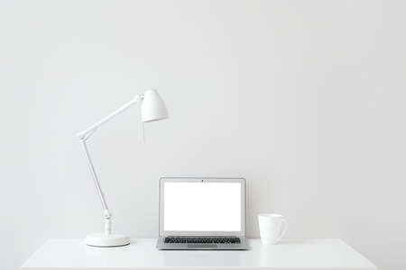 Modern laptop at workplace in officeの写真素材