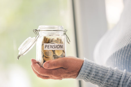 Senior woman with savings in jar at home. Concept of pension