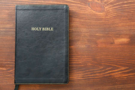 Holy Bible on wooden table