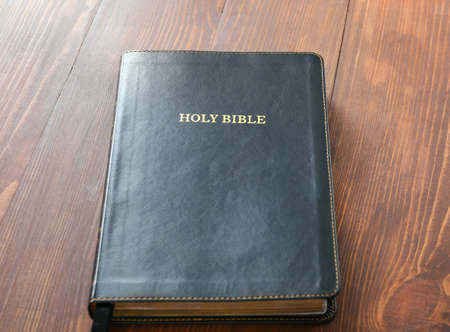 Holy Bible on wooden table