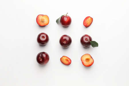 Fresh ripe plums on white backgroundの写真素材