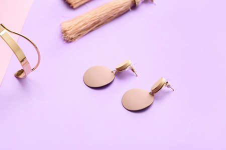 Composition with beautiful jewelry on color backgroundの写真素材