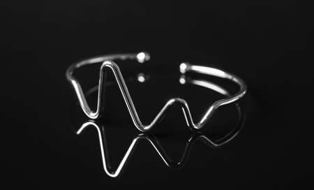 Beautiful silver bracelet on black backgroundの写真素材
