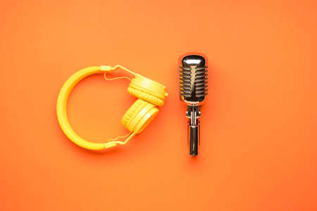 Headphones with microphone on color backgroundの写真素材