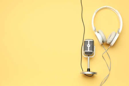 Headphones with microphone on color backgroundの写真素材