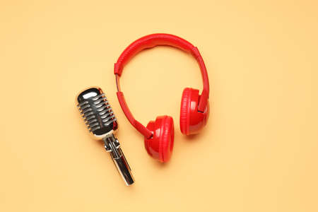 Headphones with microphone on color backgroundの写真素材