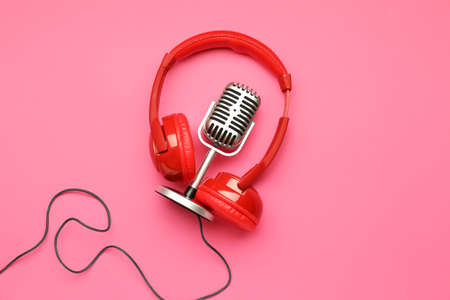 Headphones with microphone on color backgroundの写真素材