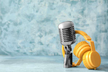 Headphones with microphone on color backgroundの写真素材