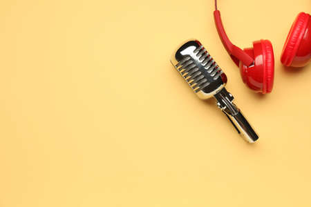 Headphones with microphone on color backgroundの写真素材
